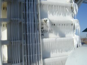 An MHE conveyor enveloped in ice