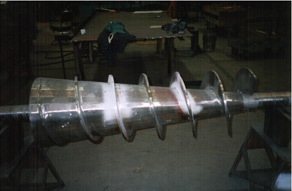 A poartion of a screw canveyor during manufacturing