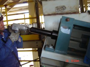 Technician servicing a conveyor component