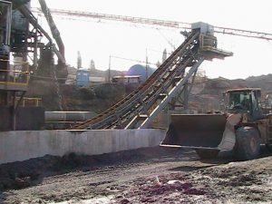Industrial waste conveyor on a job site