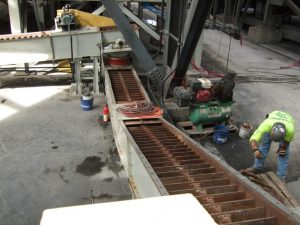 A custom drag conveyor being built