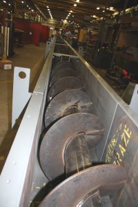 Screw conveyor being manufactured